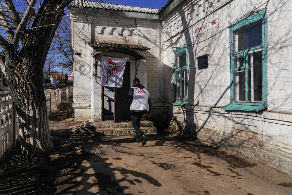 MSF doctor enters the mobile clinic in Starohnativka. February, 2019. 
